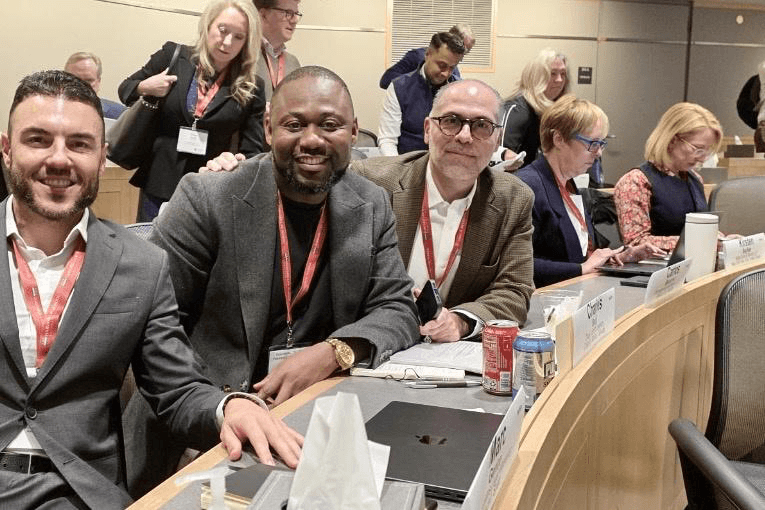 Dr. Charles Osuji in a Harvard Law School classroom with program colleagues