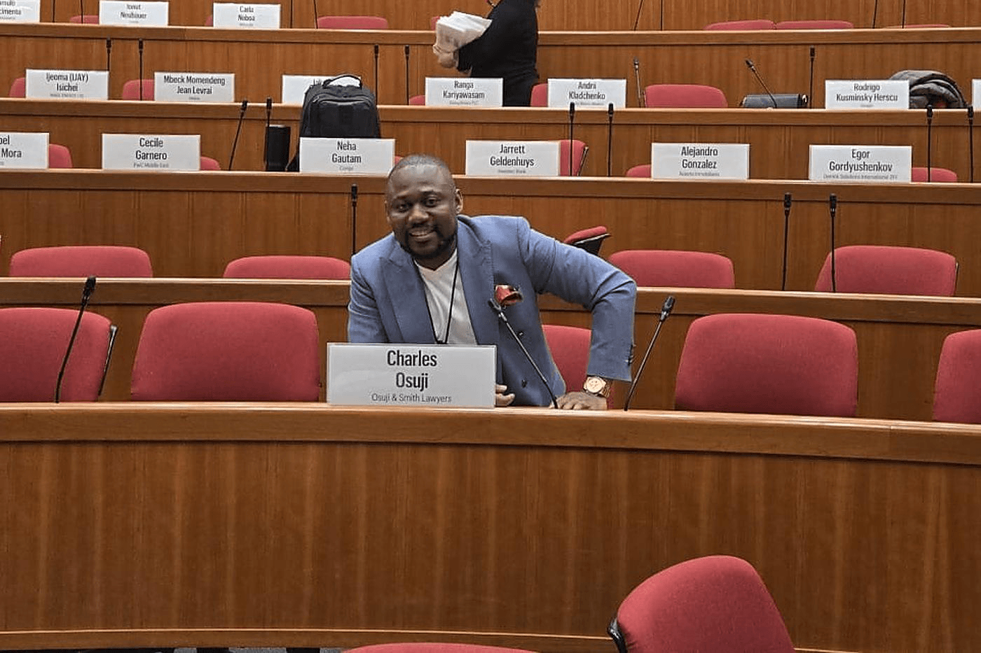 Dr. Charles Osuji seated in a Harvard Business School classroom