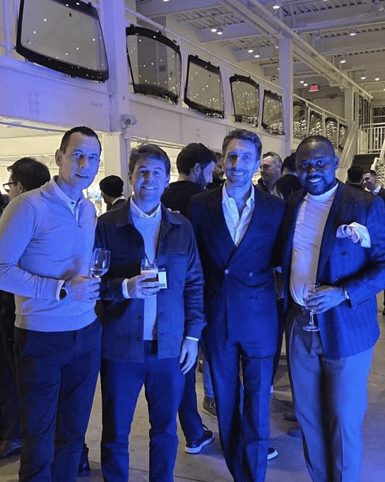 Dr. Charles Osuji with colleagues at a Harvard Business School event